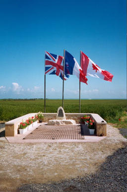 The site of B3 near St.Croix-sur-Mer in Normandy - used by 146 Wing (193, 197, 257, 263 and 266 Sqdns) July - August 1944. The plaque marks the beginning of the runway that ran through a cornfield. The steel mesh is a piece of the mesh from which the runway was constructed. Photo: Derek Lovell, 1994