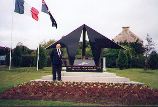 Former 197 Sqn Typhoon pilot Derek Lovell in front of the Typhoon Memorial at Noyers Bocage. Photo: Derek Lovell, 1994