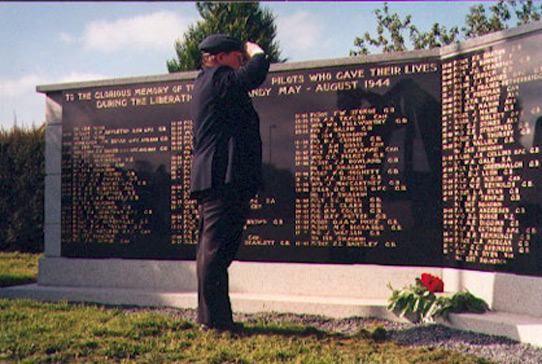 Saluting the plaques listing the 151 Typhoon pilots killed in the battle of Normandy. photo: Derek Lovell, 1994