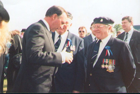 Australian Prime Minister Paul Keating talking to Derek Lovell at the Typhoon Memorial on 5th June 1994. Keating had come to lay a wreath for the Royal Australian Air Force pilots who lost their lives during the Normandy invasion. Photo: Derek Lovell, 1994
