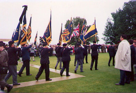 Standards arriving at the Bayeux War Cemetery for a service of remembrance attended by HM Queen Elizabeth, HRH Prince Philip, François Mitterand, and other dignitaries. Photo: Derek Lovell, 1994